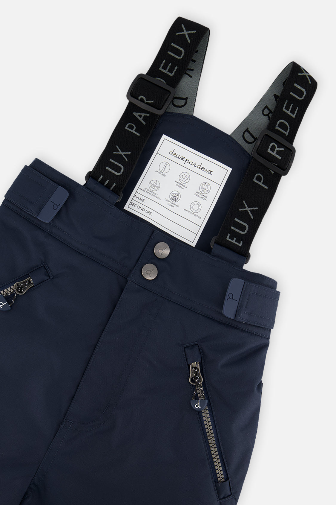 Close-up of the navy blue Deux par Deux PLAY snow pants waist, zippered pockets and suspenders