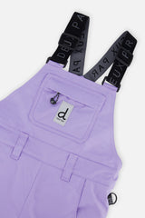 Close-up of the purple PLAY bib chest pocket and logo suspenders