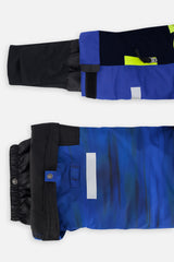 Close-up of the TEKNIK jacket cuff and the adjustable snow pant hem with snap tab