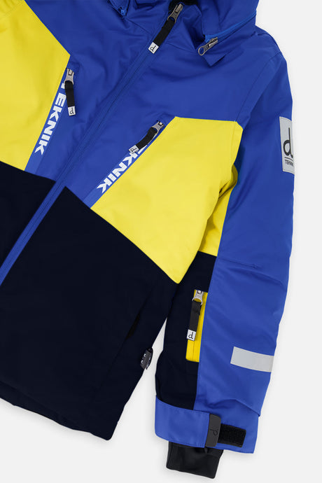 Close-up of the chest zip pockets and sleeve on the royal blue and yellow TEKNIK jacket