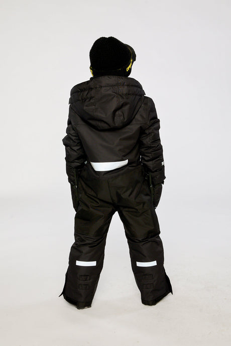 Deux par Deux kids' Teknik one-piece snowsuit in black – on a child model, back view