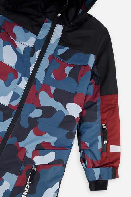 Deux par Deux boys' Teknik one-piece snowsuit in blue and red camouflage – sleeve detail close-up