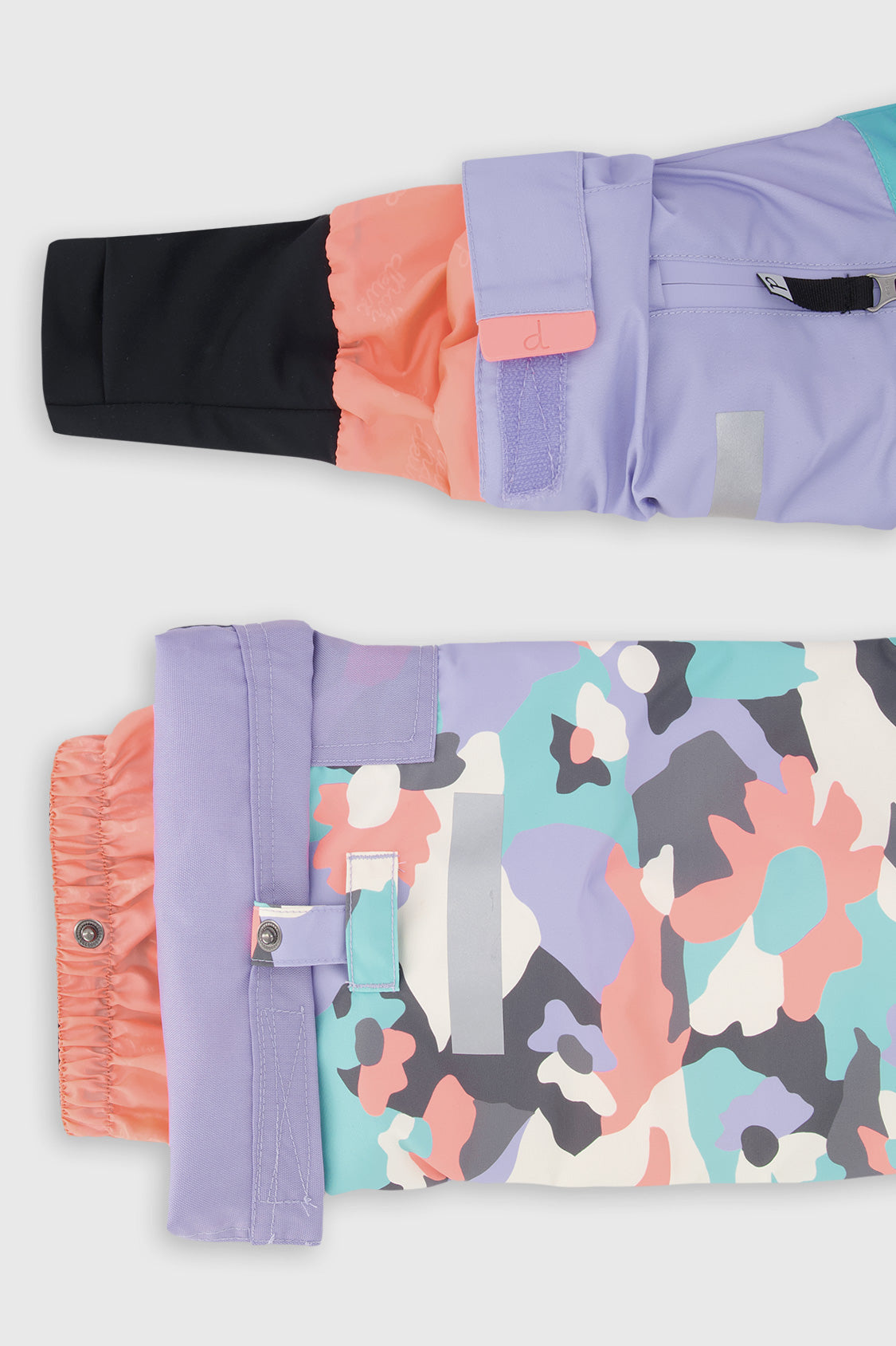 Deux par Deux girls' Teknik snowsuit, turquoise-orange-mauve color-block jacket, camo pants – sleeve cuff and pant hem details