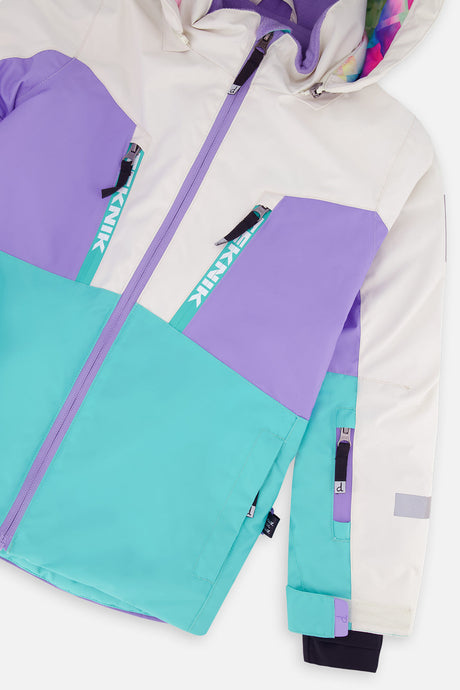 Close-up of the chest zip pockets and sleeve on the color-block TEKNIK jacket