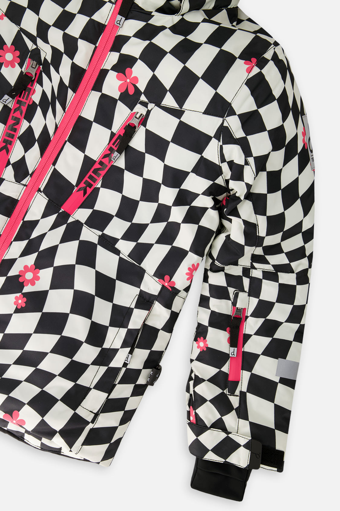 Close-up of the pink chest zippers and sleeve on the checkered TEKNIK jacket