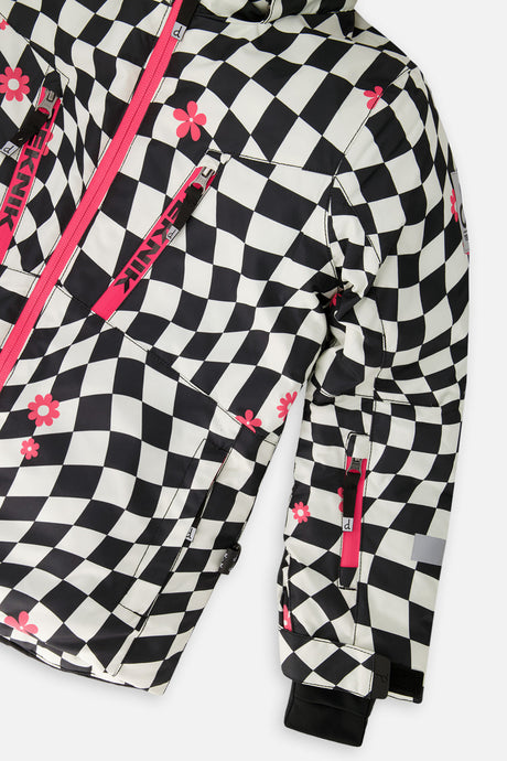 Close-up of the pink chest zippers and sleeve on the checkered TEKNIK jacket