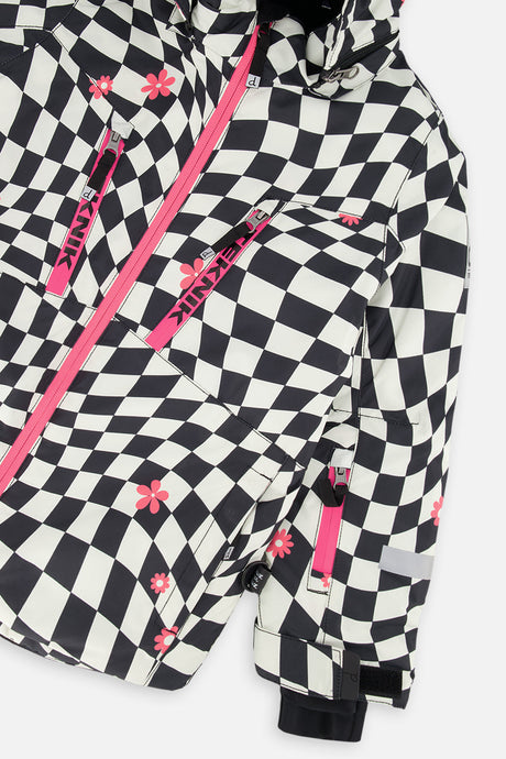 Close-up of the chest zip pockets and sleeve on the checkered TEKNIK jacket