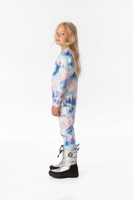 Child wearing the blue and pink mountain print base layers, side view