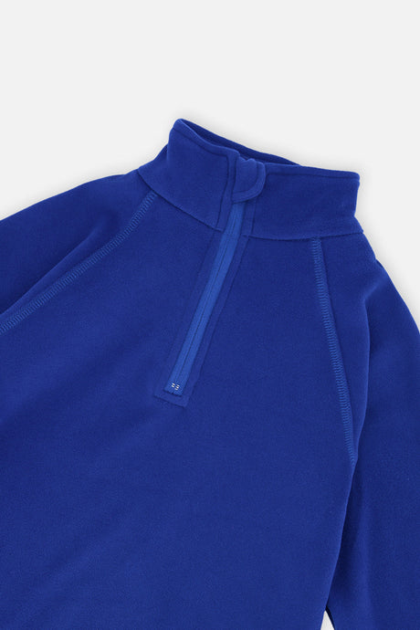 Close-up of the half-zip mock neck and raglan seams on the royal blue thermal underwear top