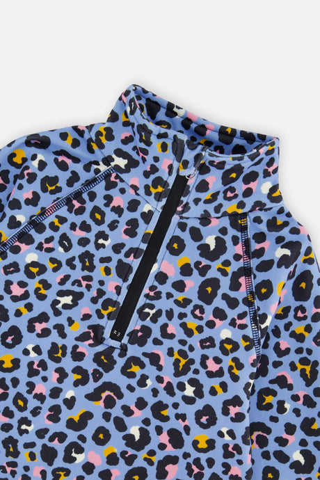 Close-up of the half-zip neck and leopard print on the blue Deux par Deux thermal underwear top