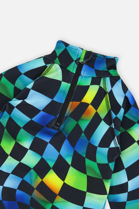 Close-up of the half-zip neck and wavy checkered print on the blue Deux par Deux thermal underwear top