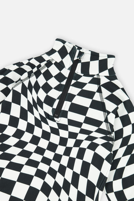 Close-up of the half-zip neck and wavy checkered print on the black and white Deux par Deux thermal underwear top