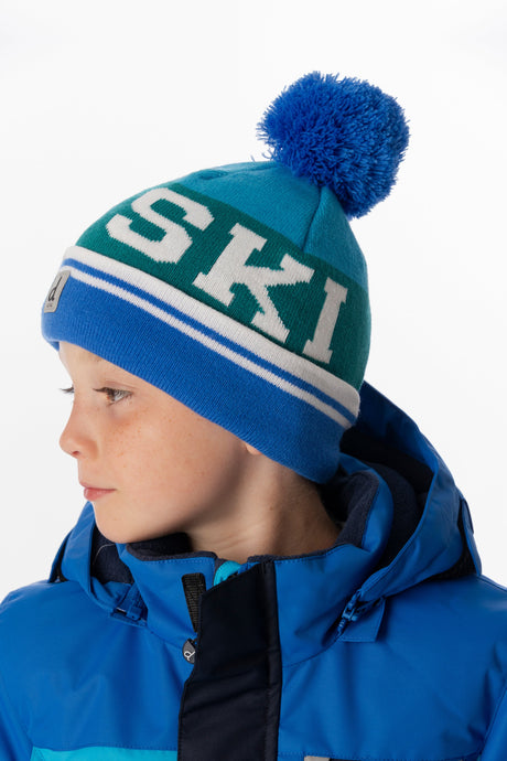 Child wearing the Deux par Deux dark blue and turquoise SKI band pompom toque