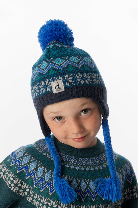 Deux par Deux kids' Peruvian Fair Isle knit hat in dark turquoise – worn by a child