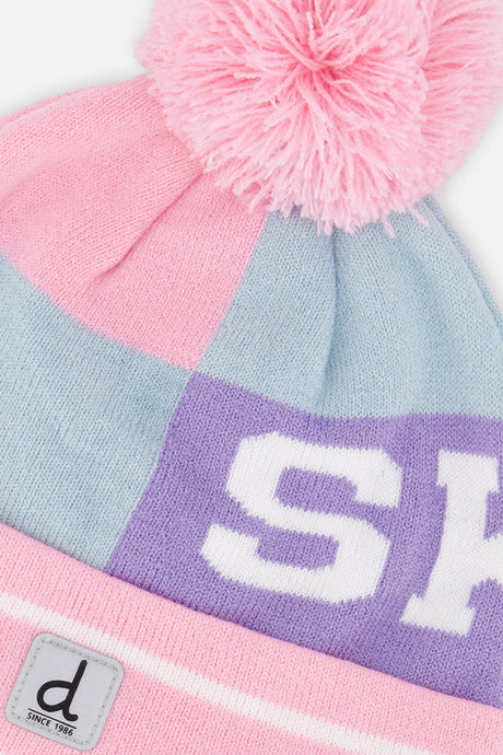 Close-up of the SKI lettering band and pink pompom on the Deux par Deux light blue and pink hat