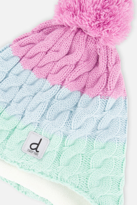 Close-up of the cable-knit color blocks, pompom and square label on the mint, light blue and violet Deux par Deux hat