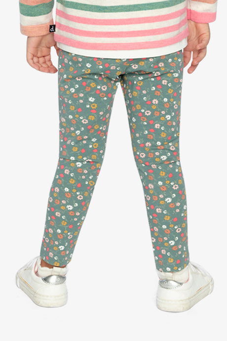 Child wearing sage green floral leggings, back view