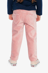 Child shown from behind in the pink treggings with heart pockets