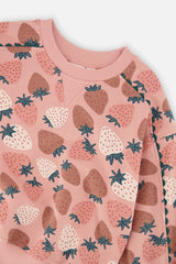 Close-up of the ribbed crew neck and strawberry print on the French terry