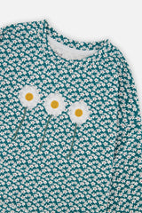 Close-up of the three embroidered daisies on the green floral print long sleeve T-shirt