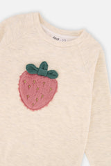 Close-up of the fuzzy strawberry appliqué with gold seeds and green leaves