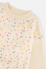 Close-up of the multicolor confetti faux fur panel on the Deux par Deux off-white sweatshirt