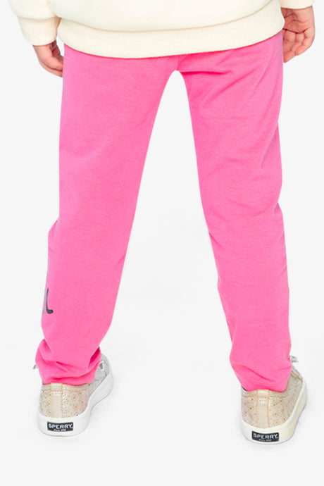 Child wearing pink leggings, back view
