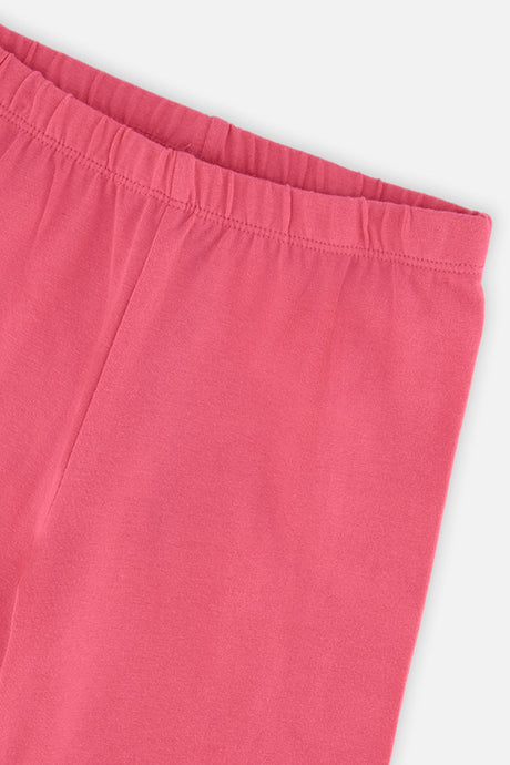 Close-up of the elastic waistband on pink leggings