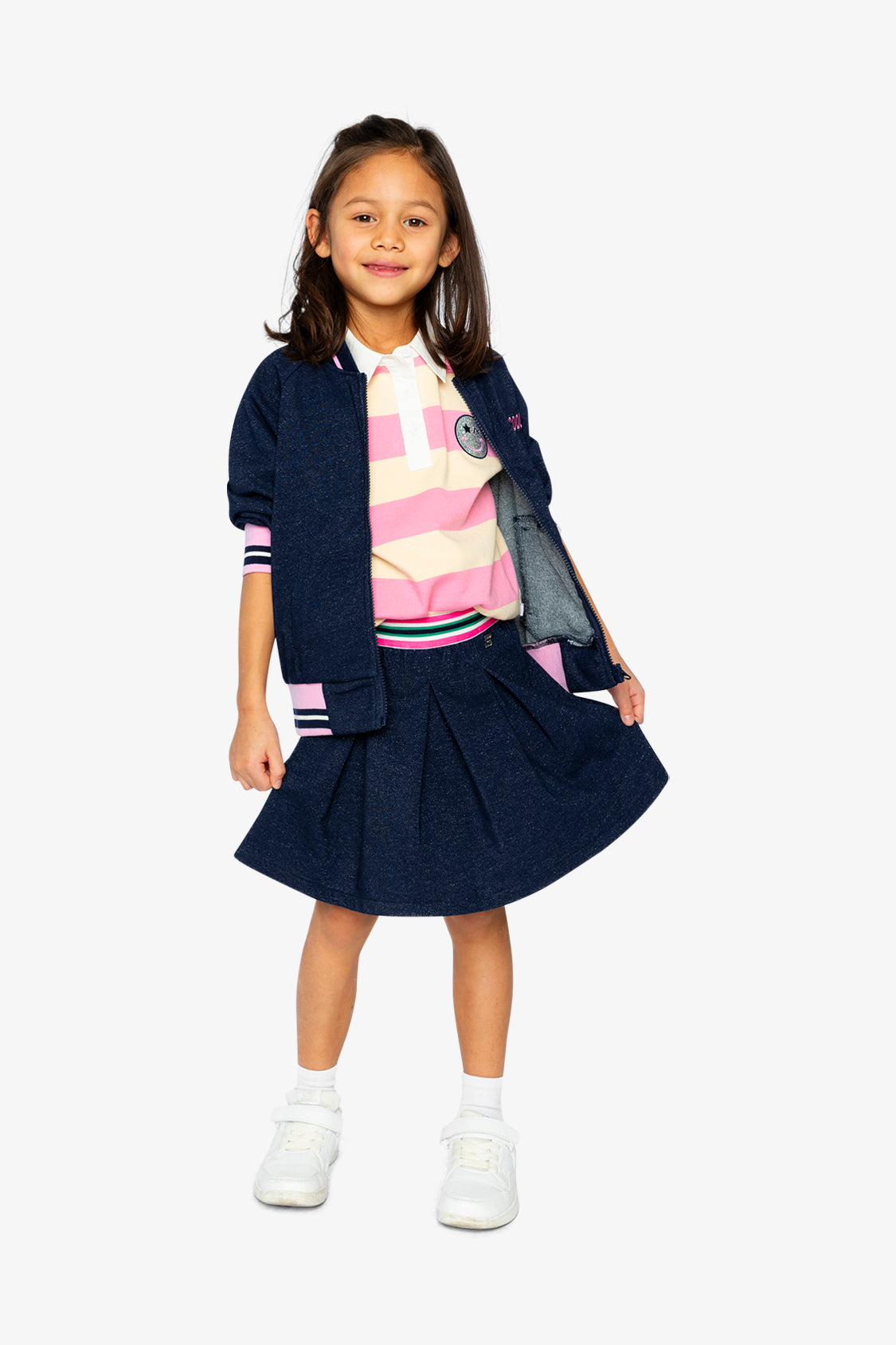 Child wearing the Pleated French Terry Skirt Navy Blue Denim in a full-length outfit