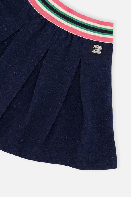 Close-up of the Pleated French Terry Skirt Navy Blue Denim striped elastic waistband and pleats