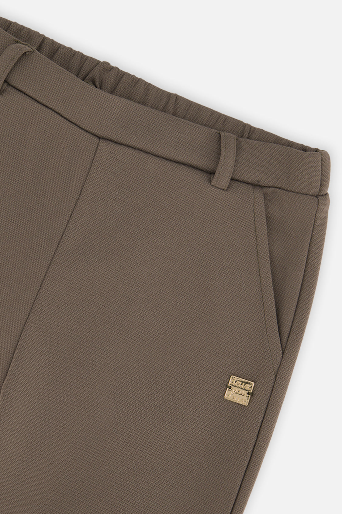 Close-up detail of the Deux par Deux sage green flare pants