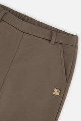 Close-up detail of the Deux par Deux sage green flare pants
