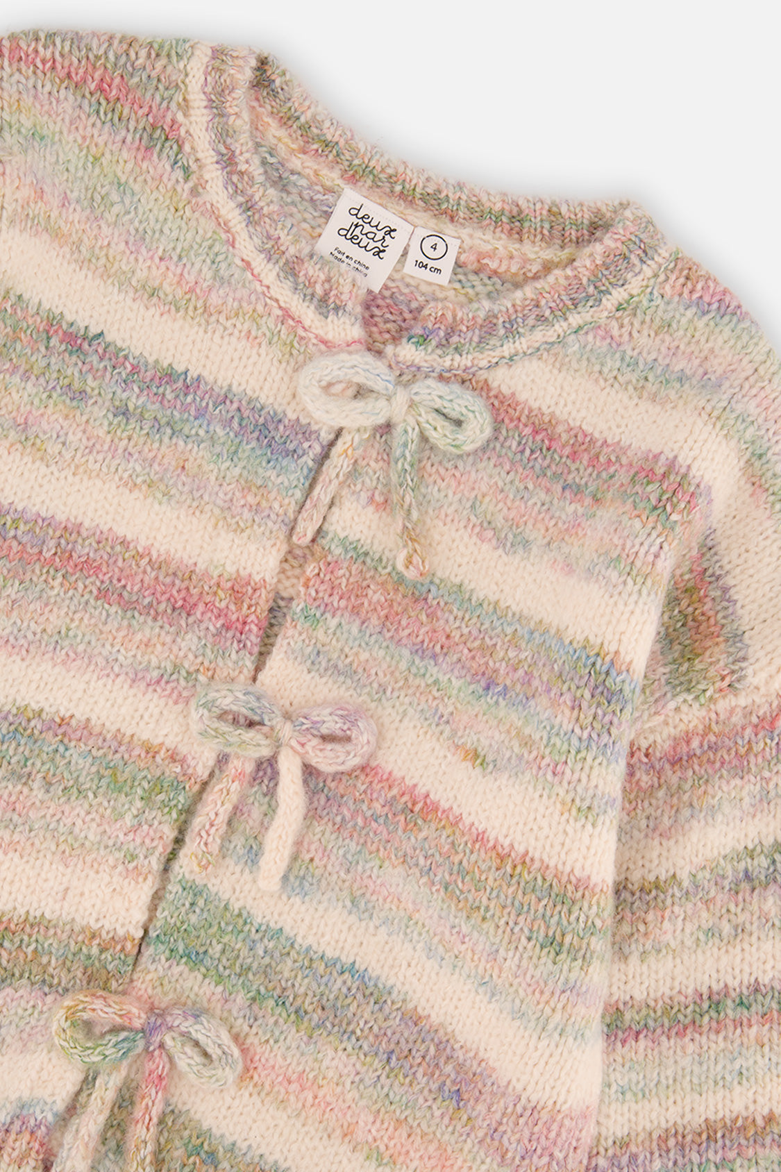 Close-up of the yarn bow appliques and the round ribbed neckline on the Deux par Deux striped knit cardigan