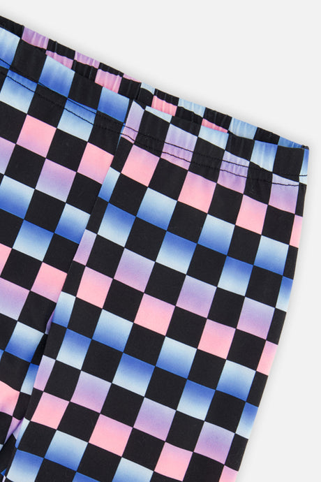 Close-up of the gradient checkerboard print and waistband on the Deux par Deux leggings