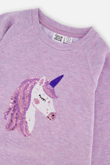 Close-up of the sequin unicorn and raglan sleeve on the violet tunic