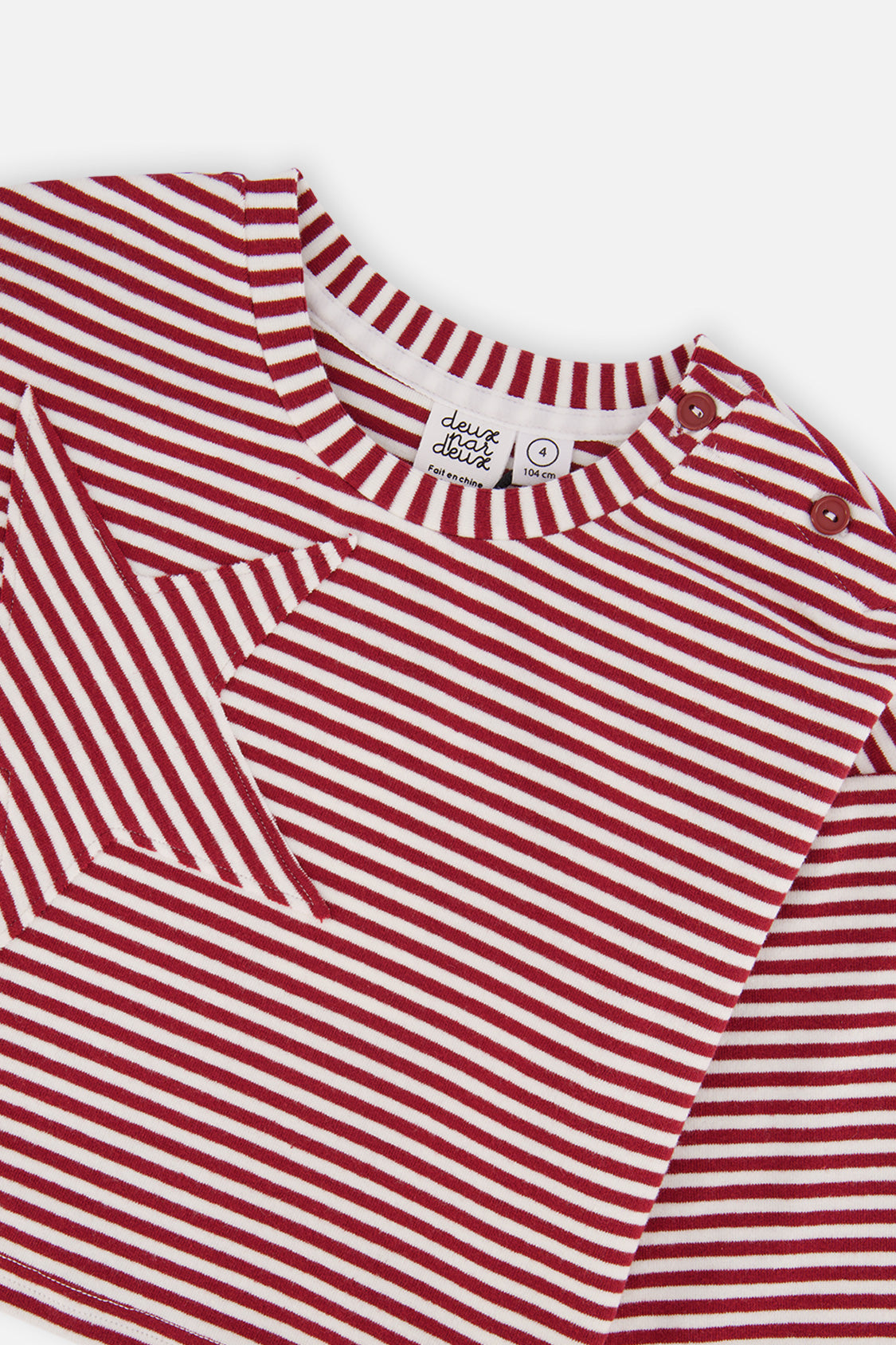 Close-up of the star appliqué and striped crew neckline