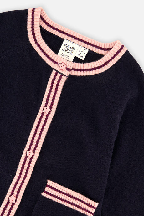 Close-up of the neckline and star-shaped buttons with pink and plum striped trim on the navy Deux par Deux cardigan