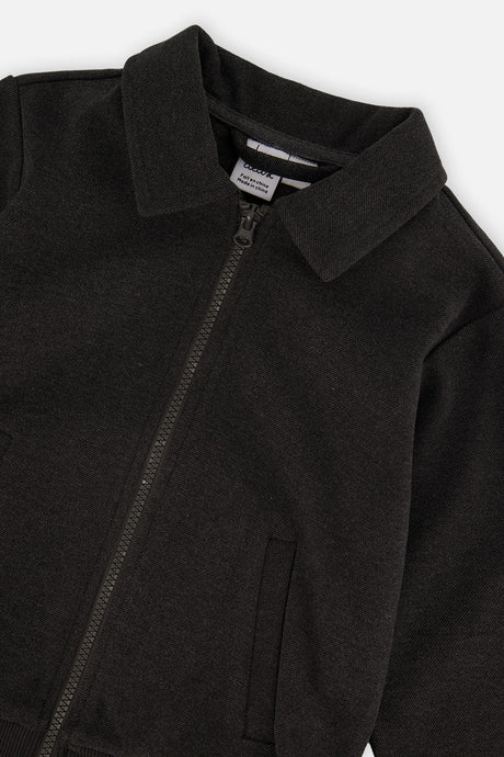 Close-up of the collar and angled front zipper on the black front zip jacket