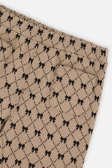 Close-up of the bow print and back pocket on the Deux par Deux beige treggings