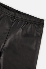 Close-up of the glossy faux leather and elastic waistband on black leggings