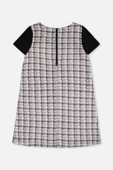 Back view of the black and white plaid dress with a centre back zip