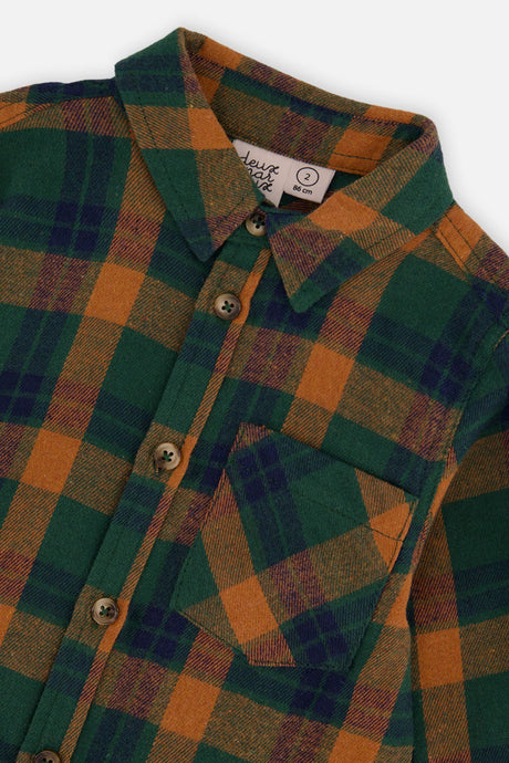 Close-up of the collar, chest pocket and buttons on the baby plaid shirt