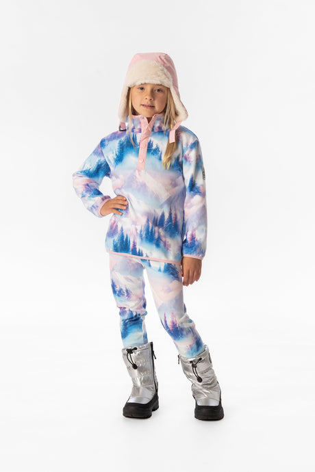 Child wearing the blue and pink mountain print fleece pullover over mountain print pants and a pink winter hat, front view