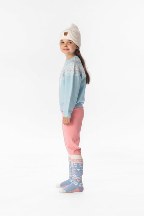 Side view of a smiling girl in the light pink thermal underwear leggings