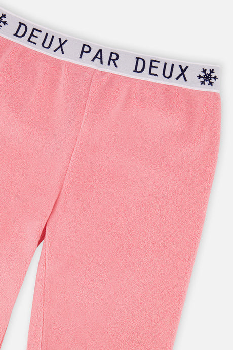 Close-up of the snowflake logo waistband on the light pink thermal leggings