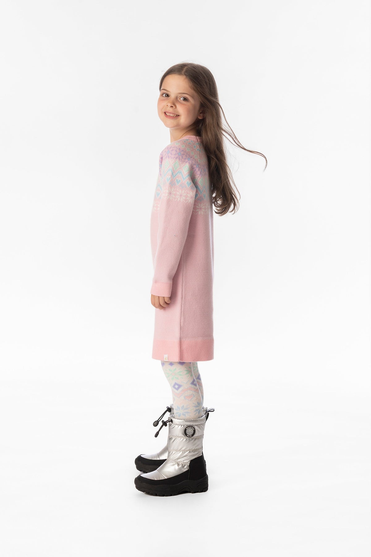 Child wearing the Deux par Deux light pink knit dress in a lookbook shot