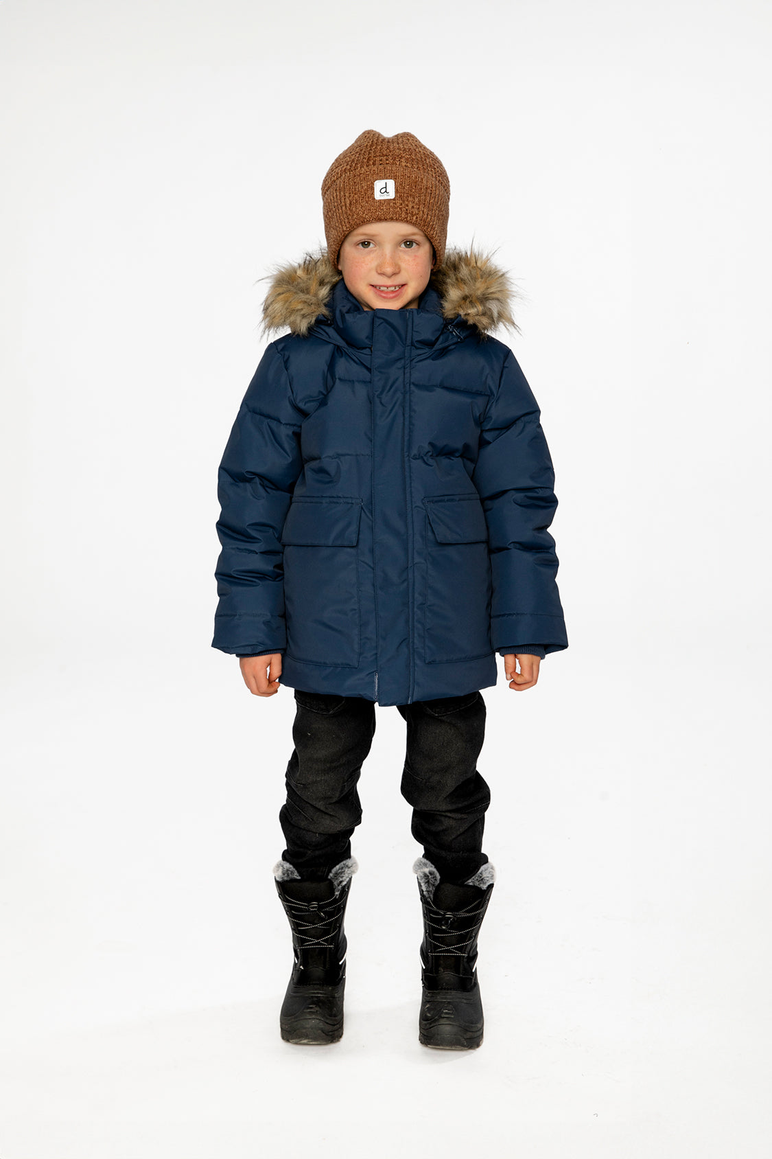 Child wearing the Deux par Deux dark blue winter jacket with faux-fur hood, view 1