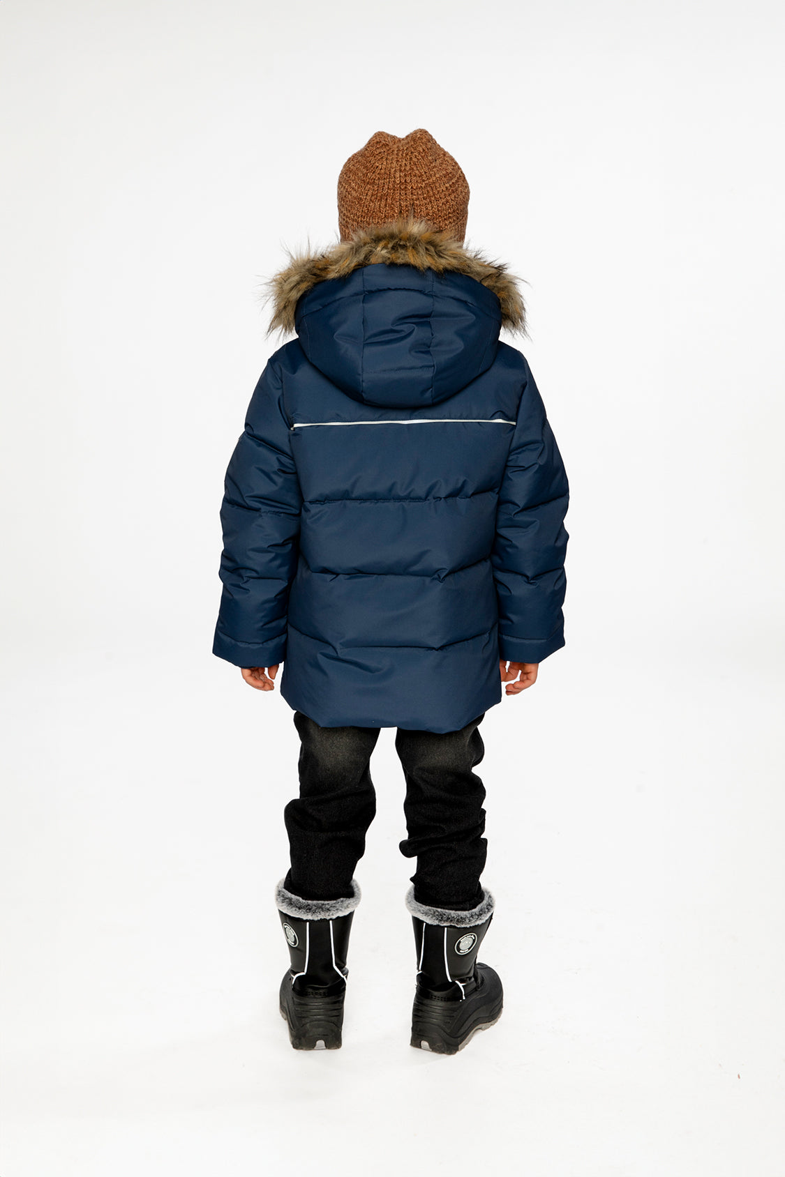 Child wearing the Deux par Deux dark blue winter jacket with faux-fur hood, view 2