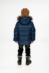 Child wearing the Deux par Deux dark blue winter jacket with faux-fur hood, view 2