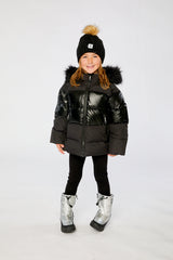 Child wearing the Deux par Deux black winter jacket with chest pattern, view 1